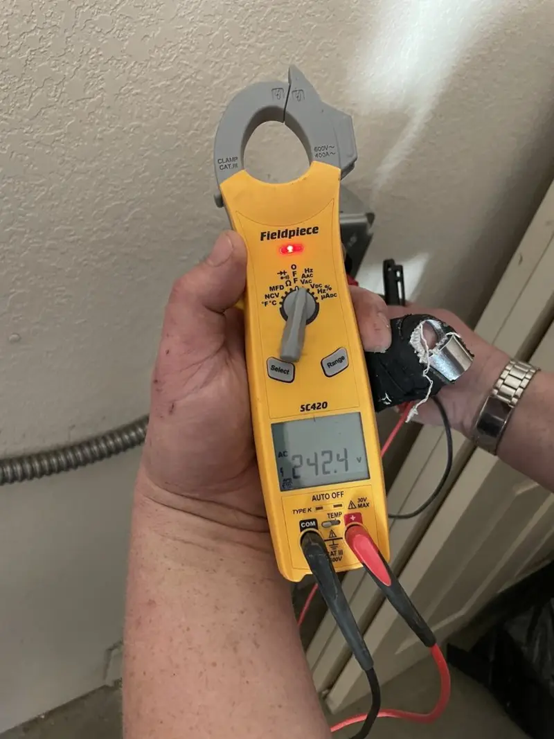 Voltage testing with clamp meter during Outlet Installation in Pleasant Prairie
